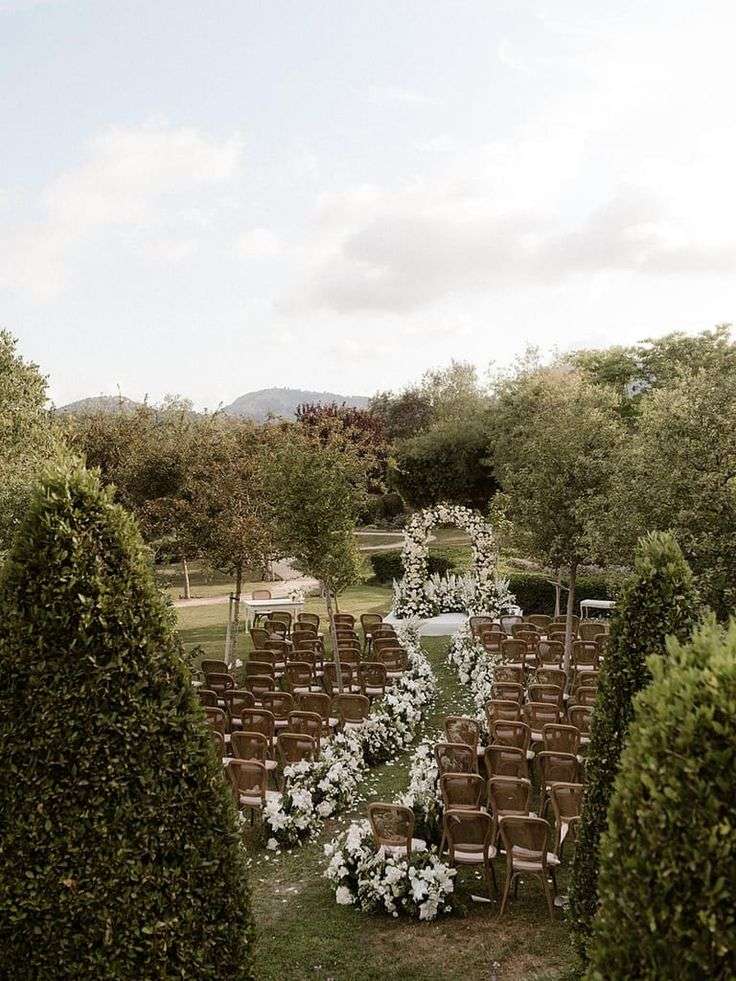 Aerial view of the garden ceremony arch and rows of rattan chairs