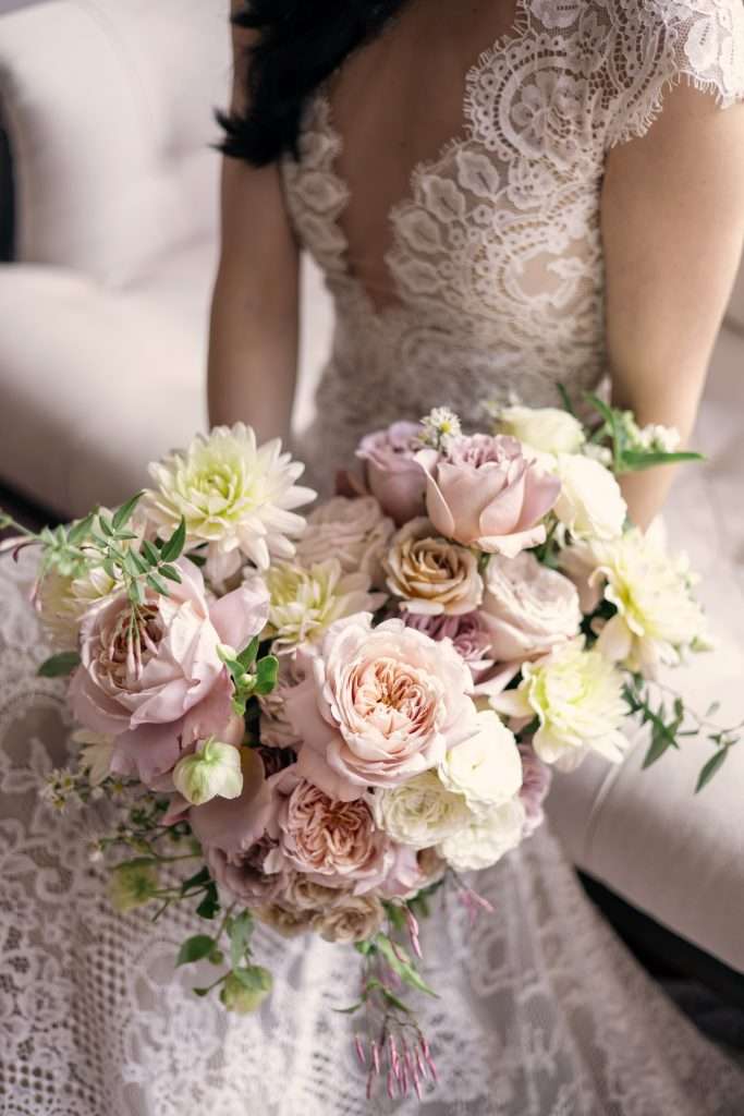 Blush, mauve and cream garden rose bouquet with dahlias close up